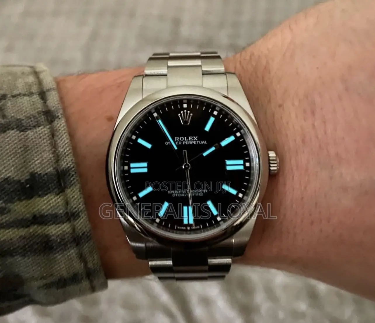 Rolex Oyster Perpetual Watch Red Dial.