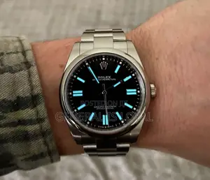 Rolex Oyster Perpetual Watch Red Dial.