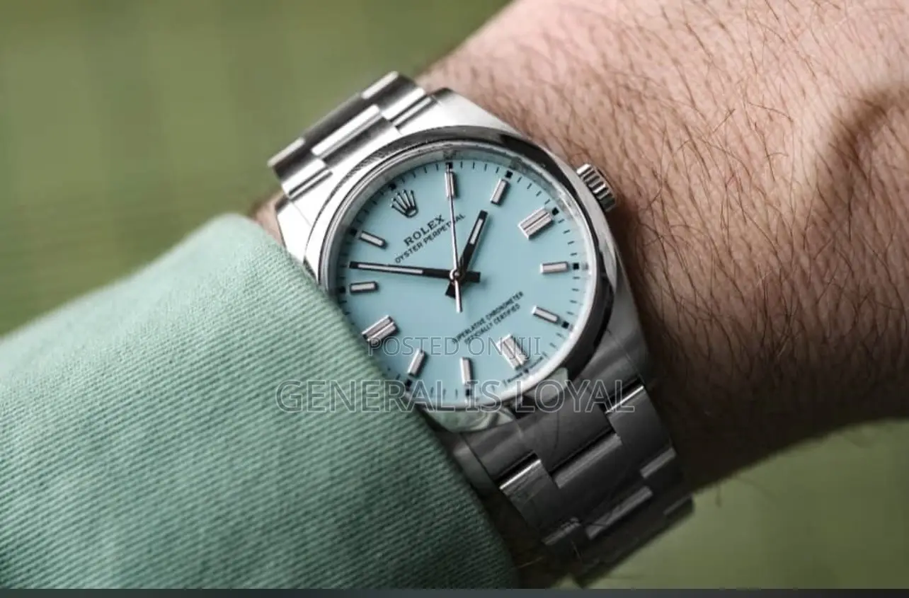 Rolex Oyster Perpetual Watch Red Dial.