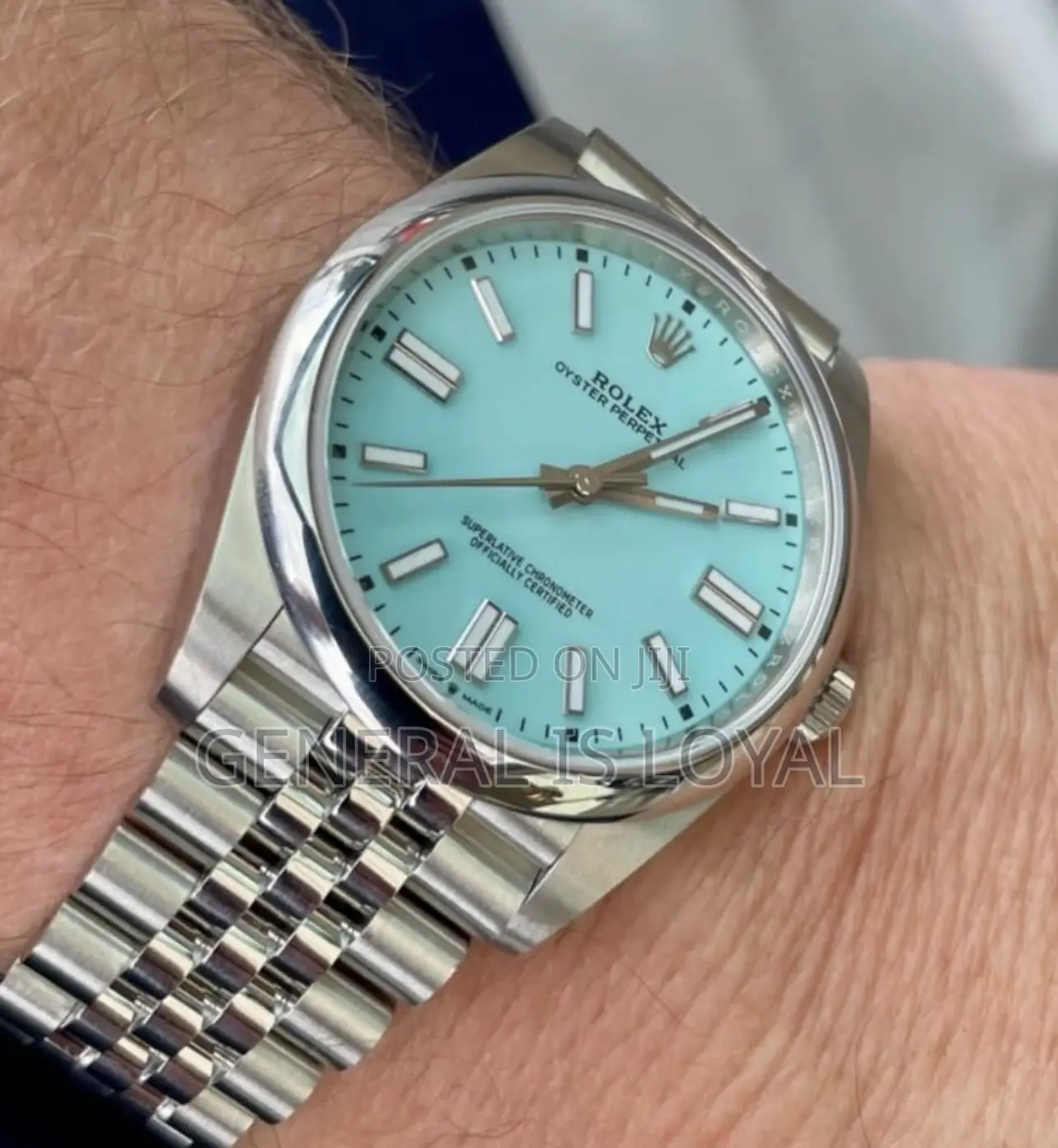 Rolex Oyster Perpetual Watch Red Dial.