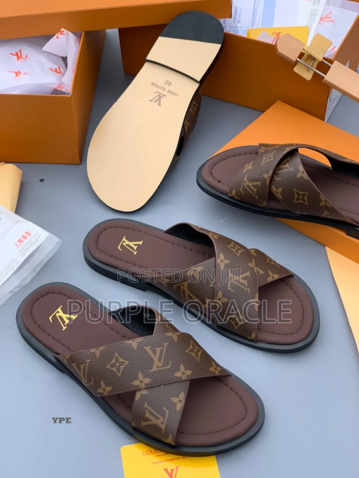 Louis Vuitton Monogram Cross-Strap Slides.