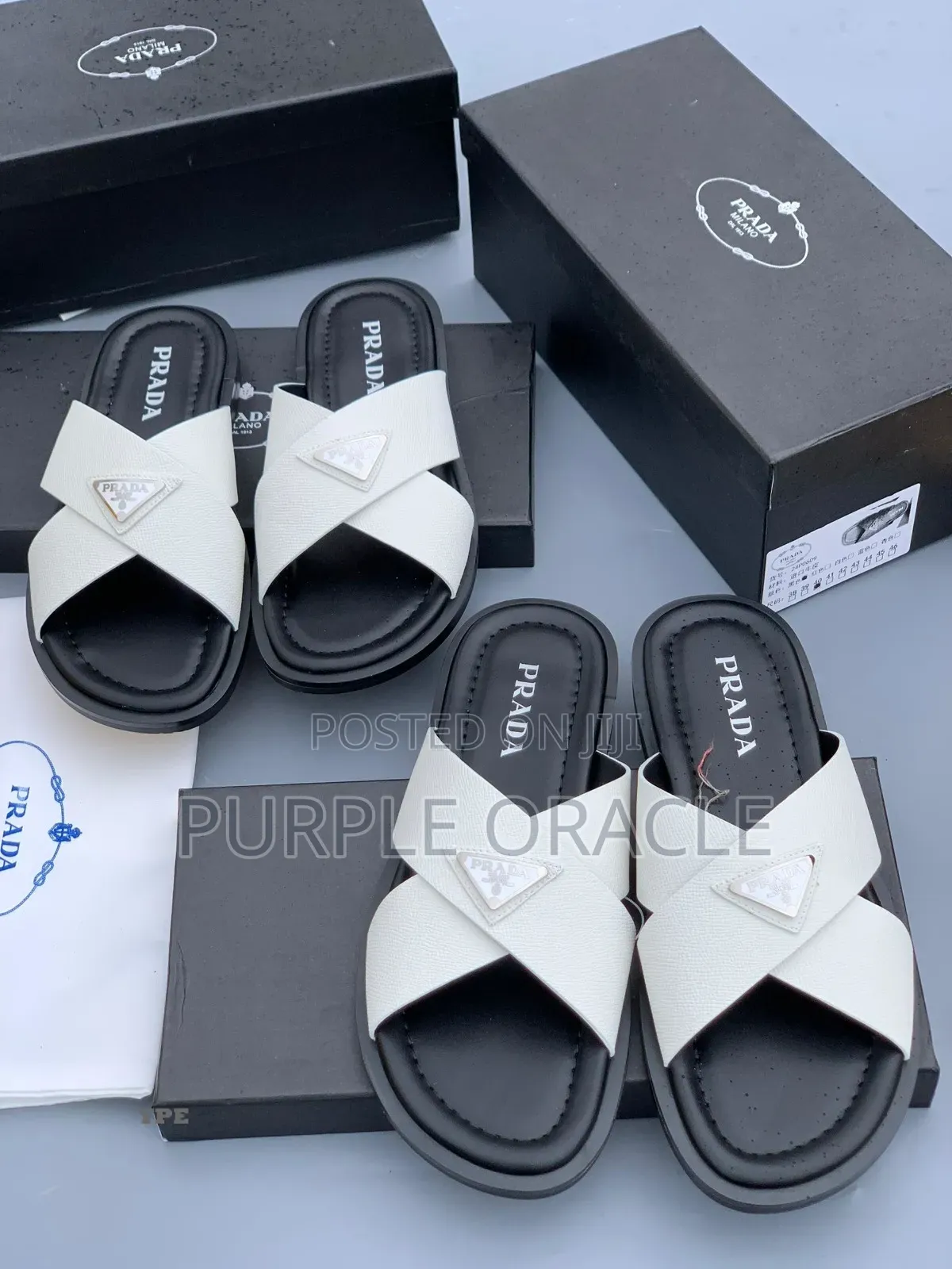Prada White and Bkack Cross-Strap Slides.