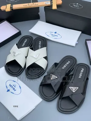 Prada White and Bkack Cross-Strap Slides.