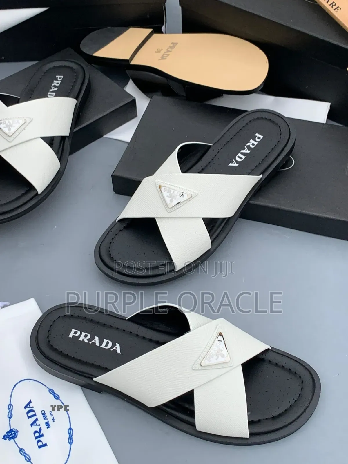 Prada White and Bkack Cross-Strap Slides.