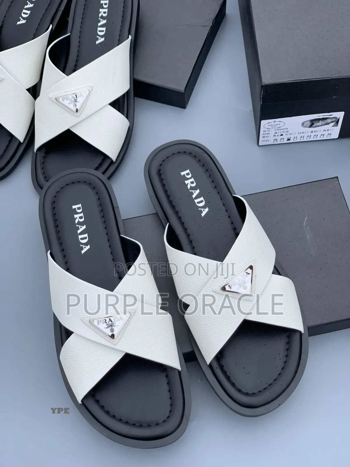 Prada White and Bkack Cross-Strap Slides.