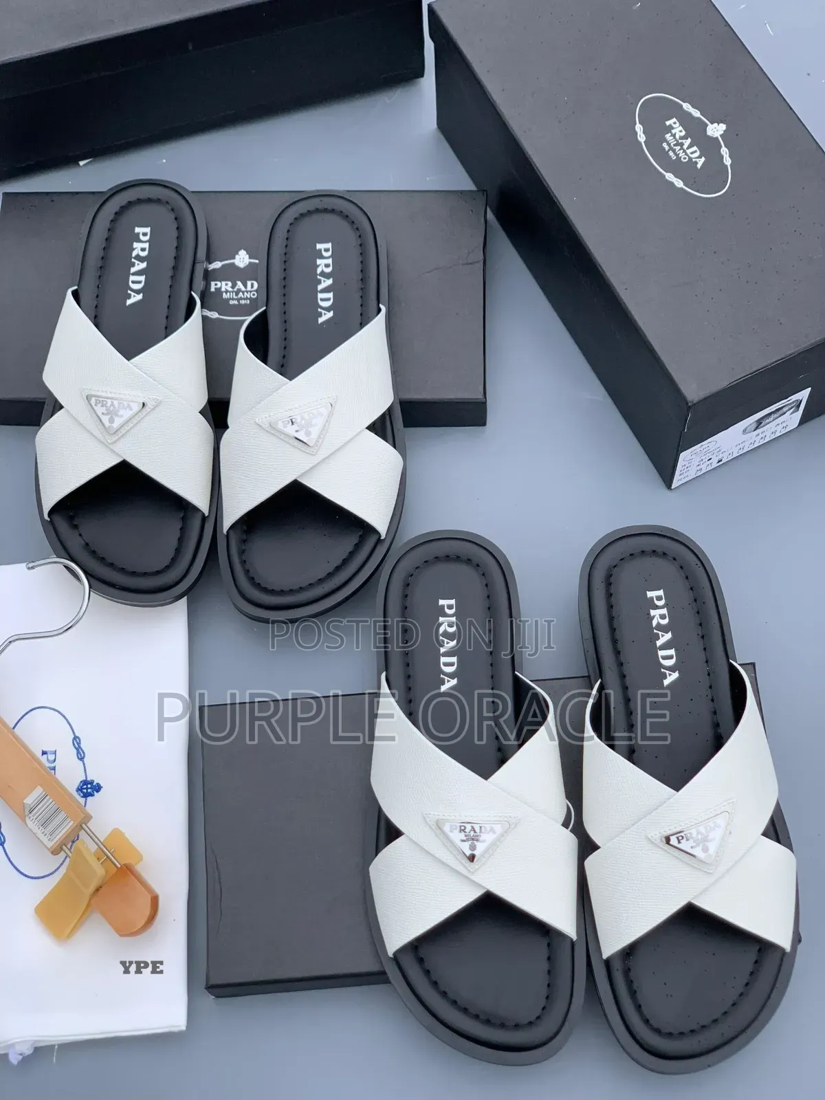 Prada White and Bkack Cross-Strap Slides.