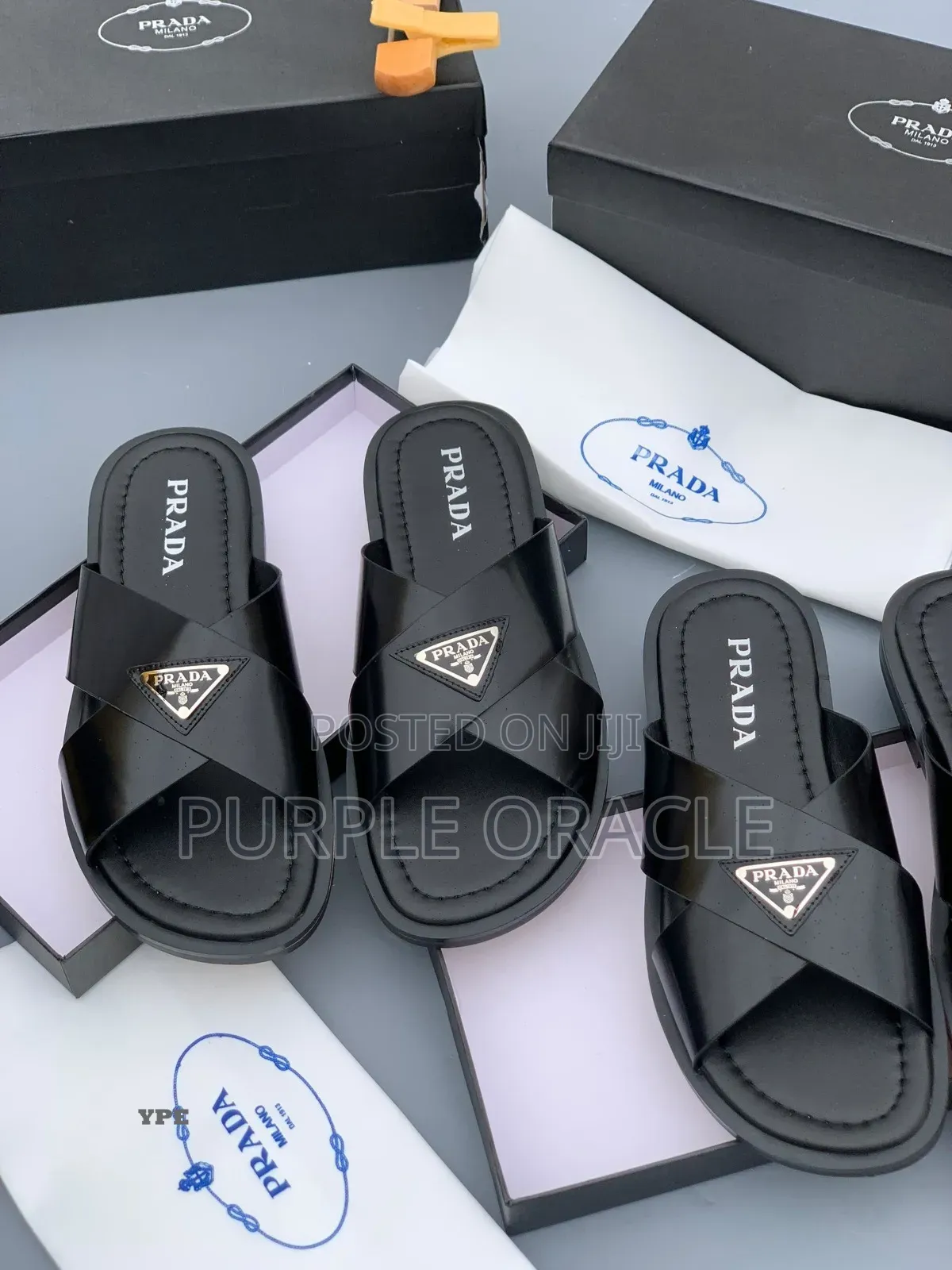 Prada White and Bkack Cross-Strap Slides.