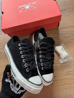 Photo - Black White Converse All Stars Sneakers for Men.