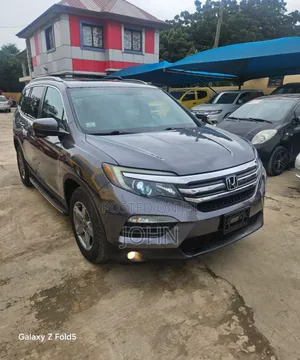 Honda Pilot Touring 4dr SUV 4WD (3.5L 6cyl 9A) 2017 Gray