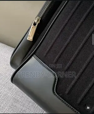Leather-Trimmed Canvas Backpacks