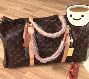 Louis Vuitton Keepall Bandoulière Duffle Bag.
