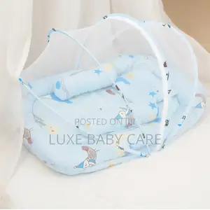 Portable Baby Bed With an Integrated Mosquito Net.