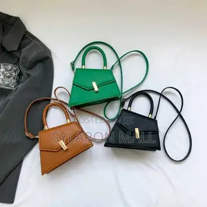 Emerald Twist Top Handle Mini Bag
