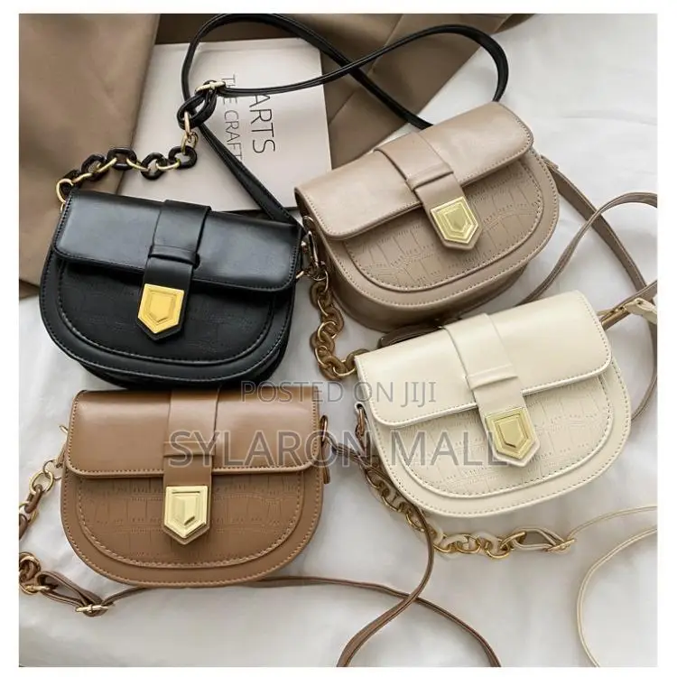 Compact Buckle-Flap Saddle Bag – Tan With Chain Accent
