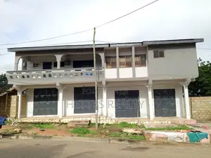 Storey Building With 4 Stores on 1 1/2 Plots