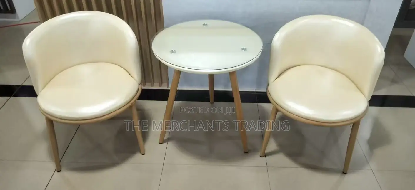 Two Set Leather Couch Chairs With Glass Table.