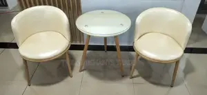 Two Set Leather Couch Chairs With Glass Table.