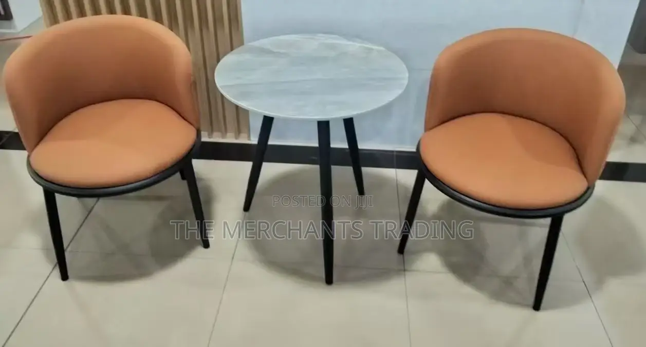 Two Set Leather Couch Chairs With Glass Table.
