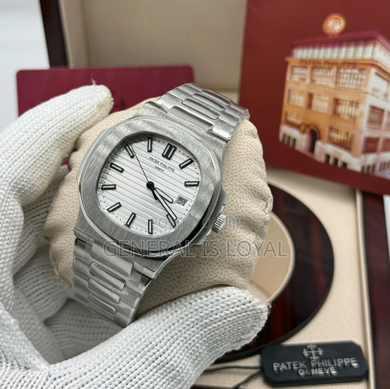 Patek Philippe Silver Stainless Steel Nautilus Watch  Black Dial.