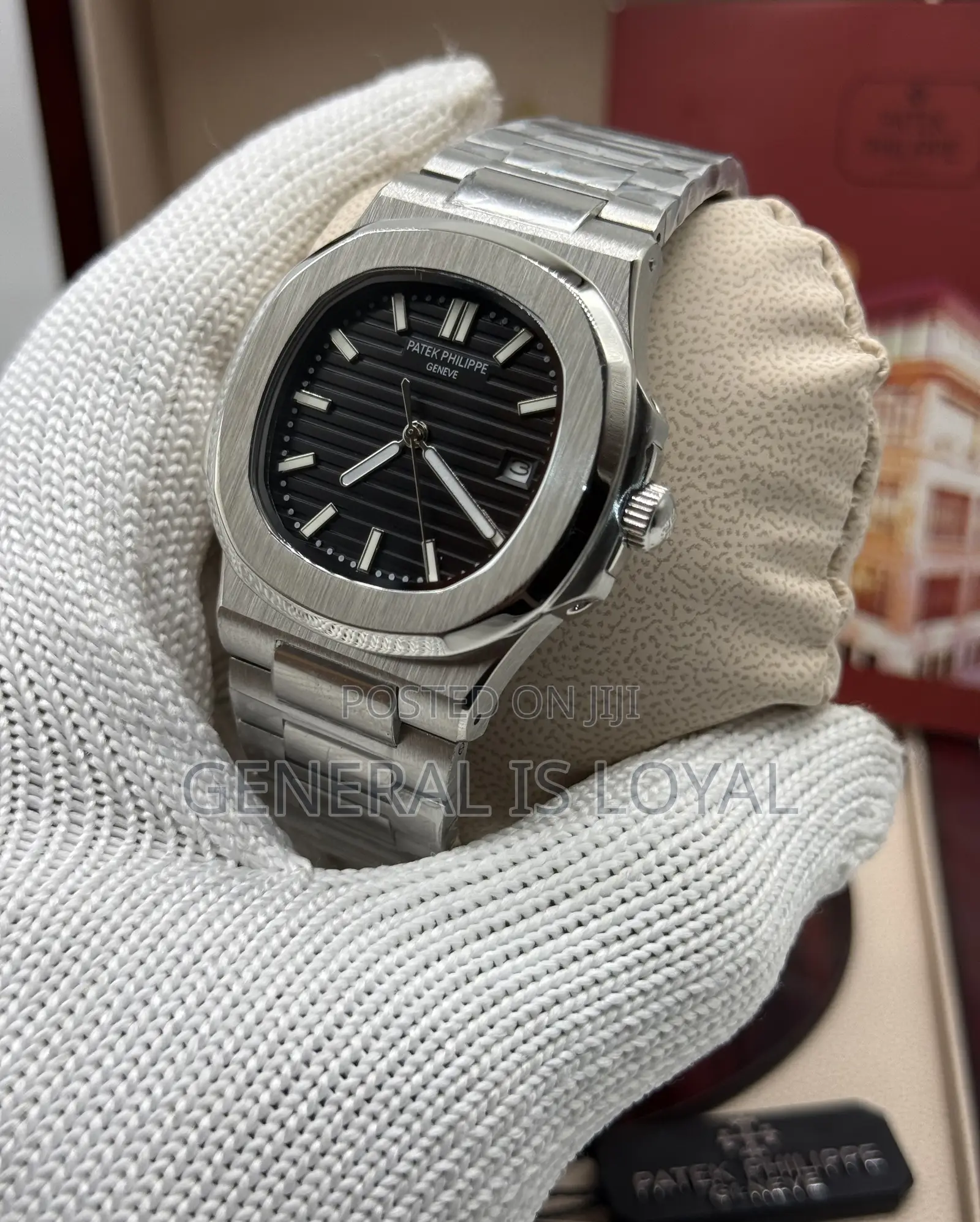 Patek Philippe Silver Stainless Steel Nautilus Watch  Black Dial.