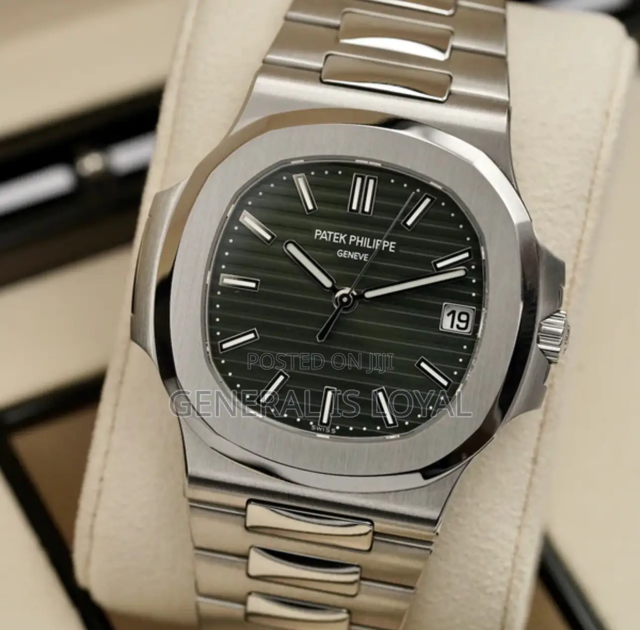 Patek Philippe Silver Stainless Steel Nautilus Watch  Black Dial.