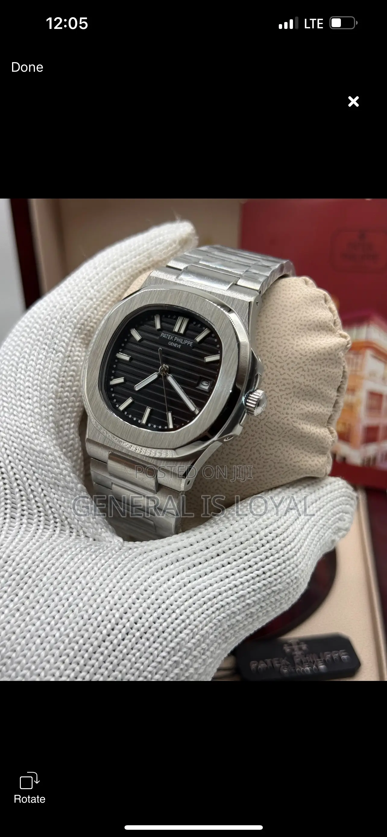 Patek Philippe Silver Stainless Steel Nautilus Watch  Black Dial.