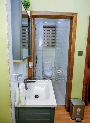 2 BDRM Vacation Apartment With Water Heater Kitchen at Kumasi Suame