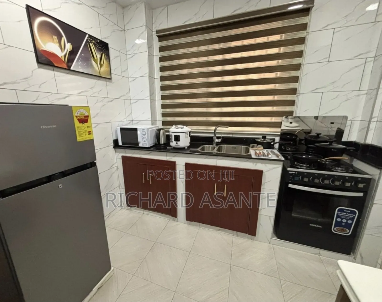 2 BDRM Vacation Apartment With Water Heater Kitchen at Kumasi Suame