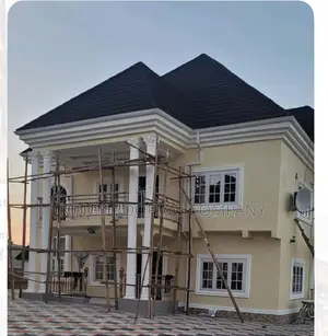 Yellow House Roofed With Quality Euro Roofing Tiles