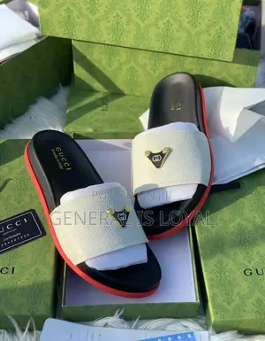 Gucci Slide Sandals With A White Strap, Black Footbed, And Red Sole