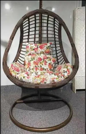 Rattan Hanging Egg Chair With A Floral Cushion
