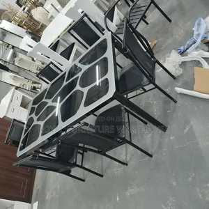 Modern Metal and Glass Dining Table Set With Six Black Chairs