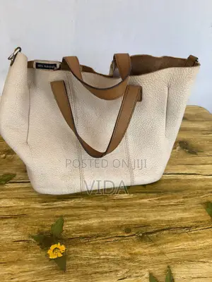 Minimalist Cream Pebbled Leather Tote With Tan Handles