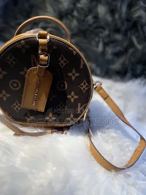 Round Monogram Crossbody Bag.