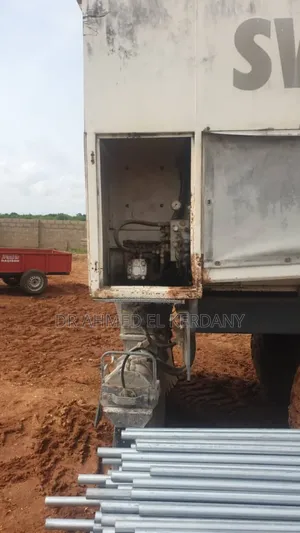 Cement Trailer and Spreader for Road Construction