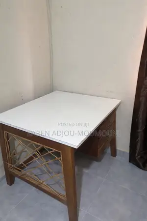 Wooden Study Desk With White Top With Its Rattan Chair