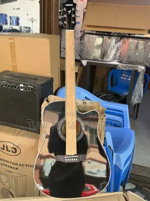 Yamaha Acoustic Guitar With A Cutaway Body Style.