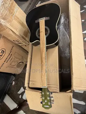 Yamaha Acoustic Guitar With A Cutaway Body Style.