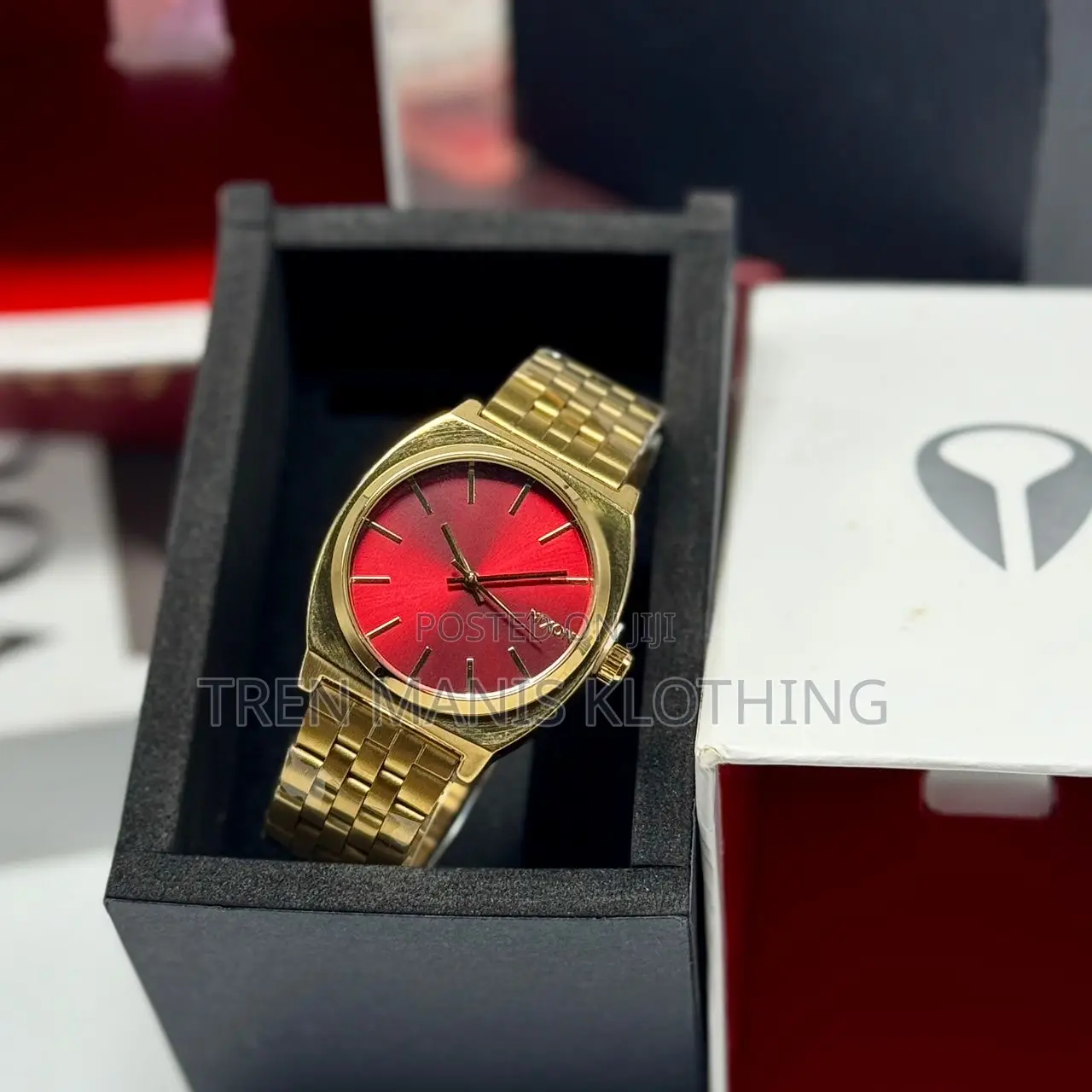 Nixon Gold Watch With Red Surface
