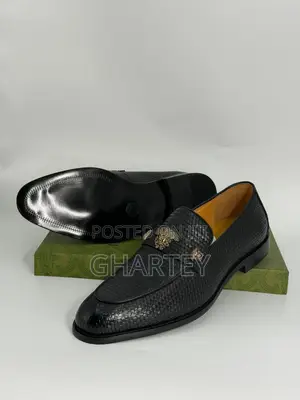 Luxury Textured Leather Loafers With Gold Crest Detail
