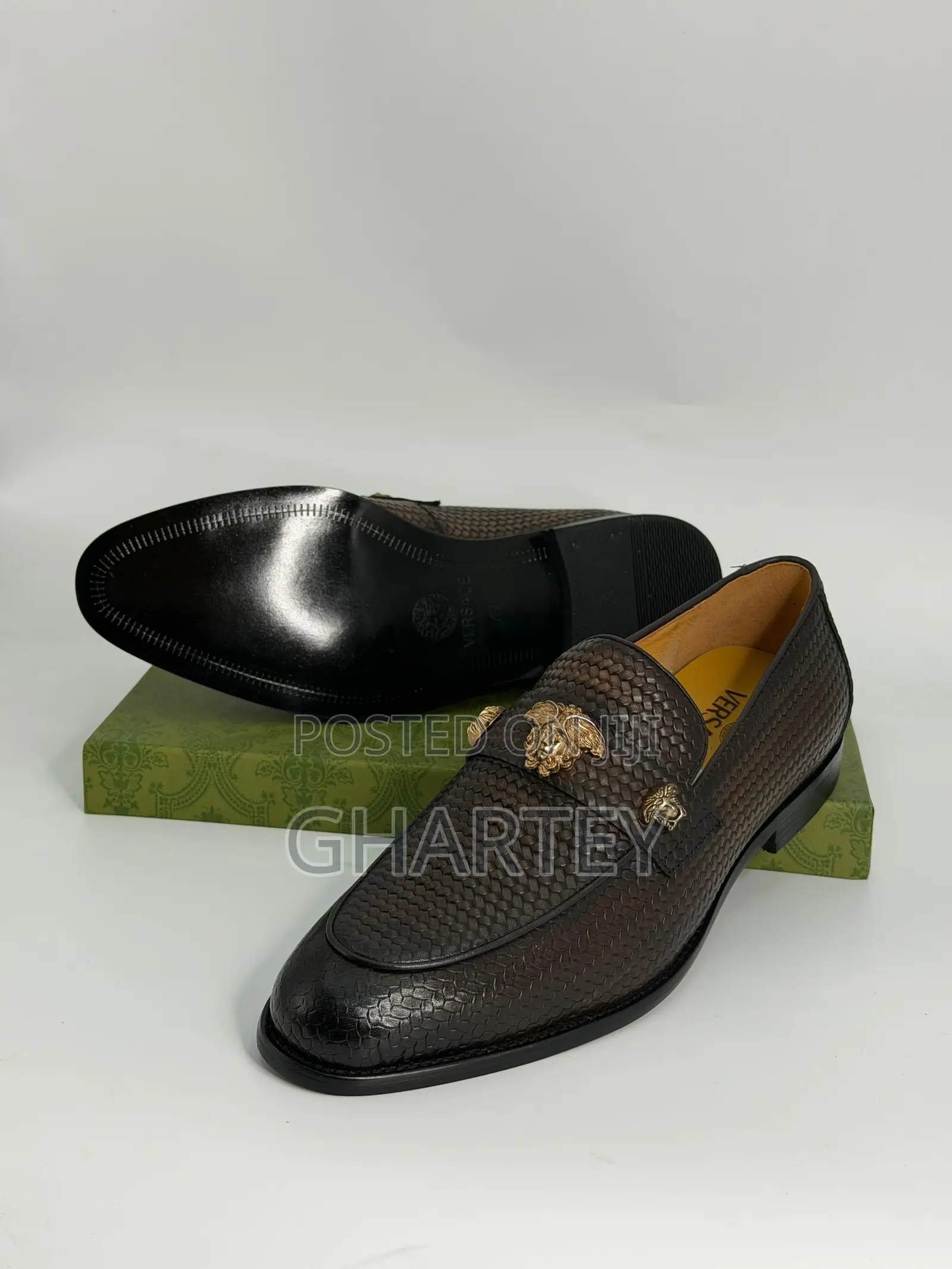 Luxury Textured Leather Loafers With Gold Crest Detail
