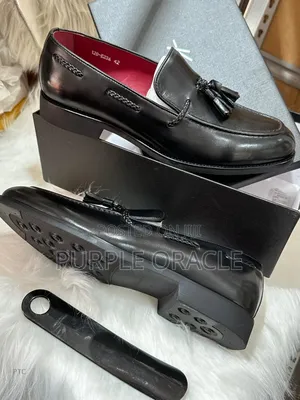 Kenneth Cole Black Leather Tassel Loafers.