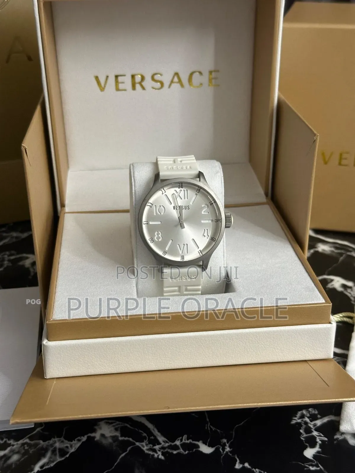 Versus Versace City Watch In A Silver Case And White Rubber Strap.