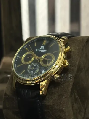 Gold-tone Binger Men's Watch With A Black Leather Strap.