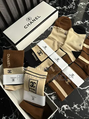Chanel-branded Socks In A Variety Of Neutral Colors.