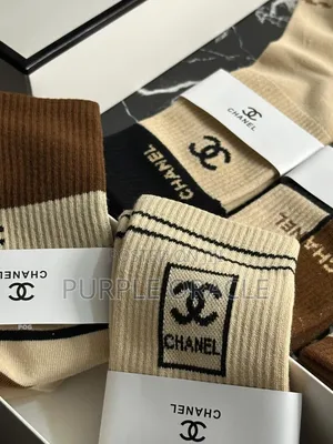 Chanel-branded Socks In A Variety Of Neutral Colors.