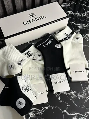 Chanel-branded Socks In A Variety Of Neutral Colors.
