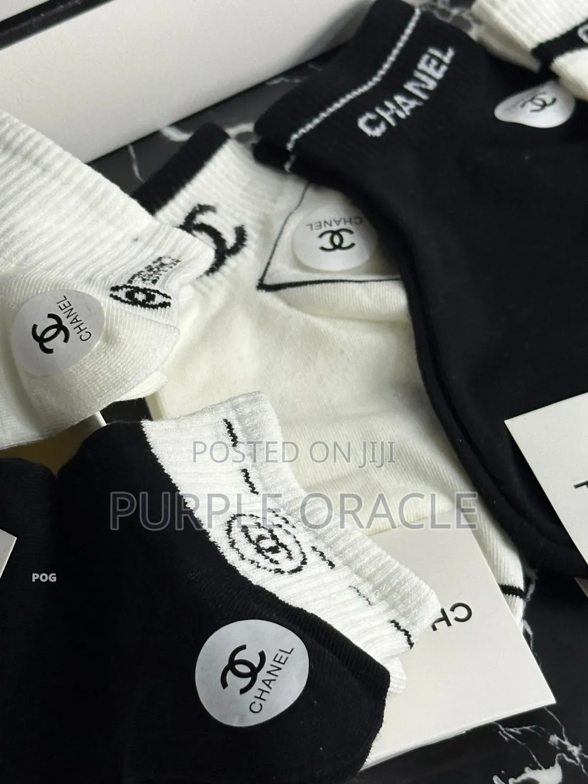 Chanel-branded Socks In A Variety Of Neutral Colors.