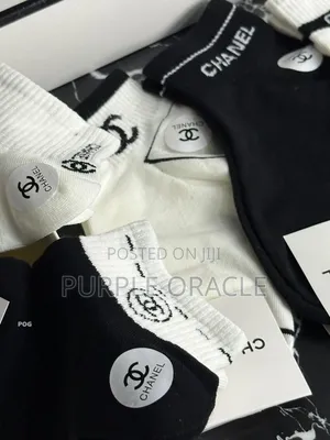 Chanel-branded Socks In A Variety Of Neutral Colors.