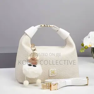 Cream Textured Hobo Bag With White Pom-Pom Charm